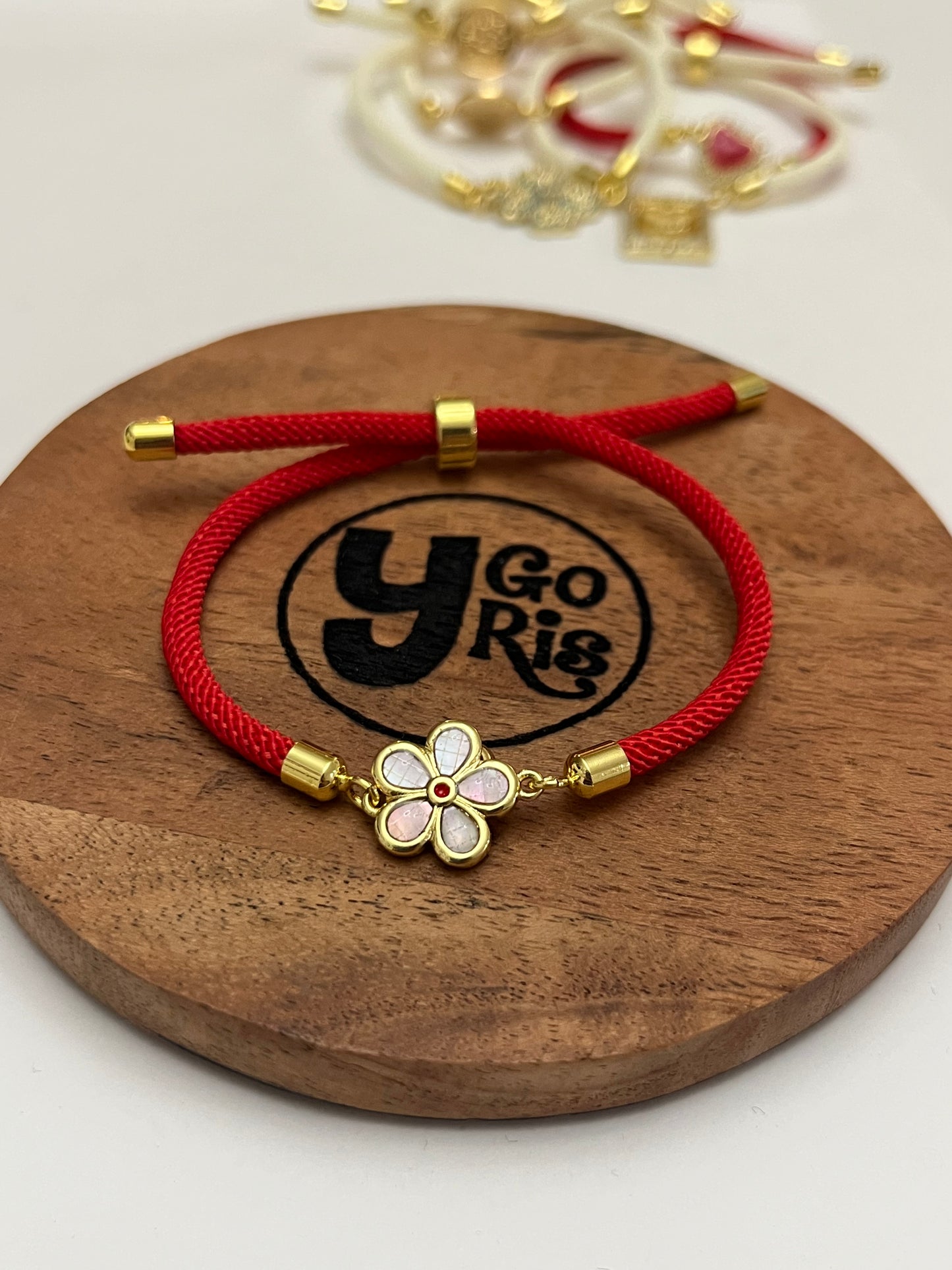 Adjustable red bracelet flower connector