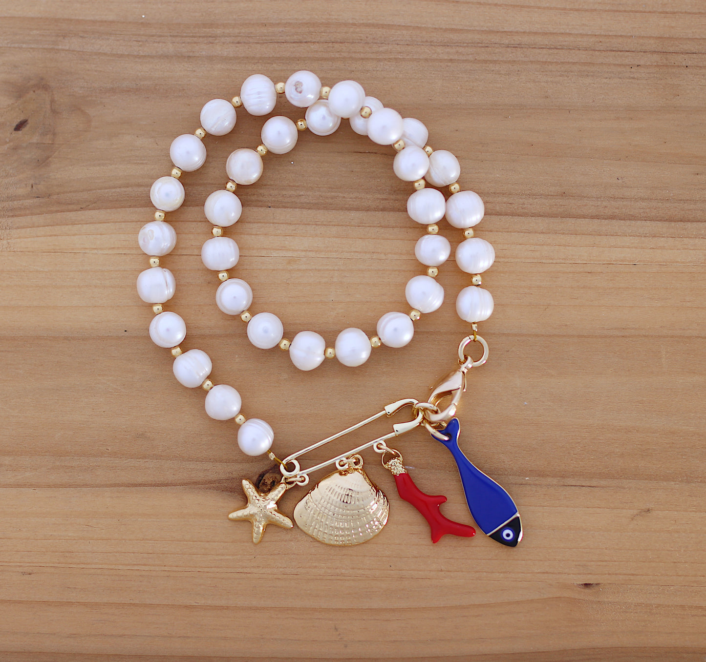 Pear necklace with sea motifs charms