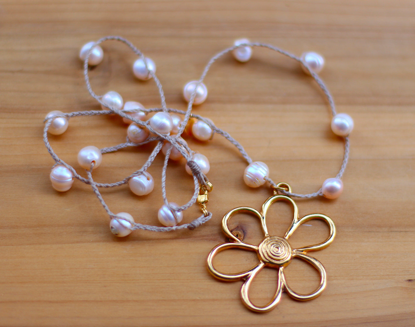 Pearl and over sized flower pendant.