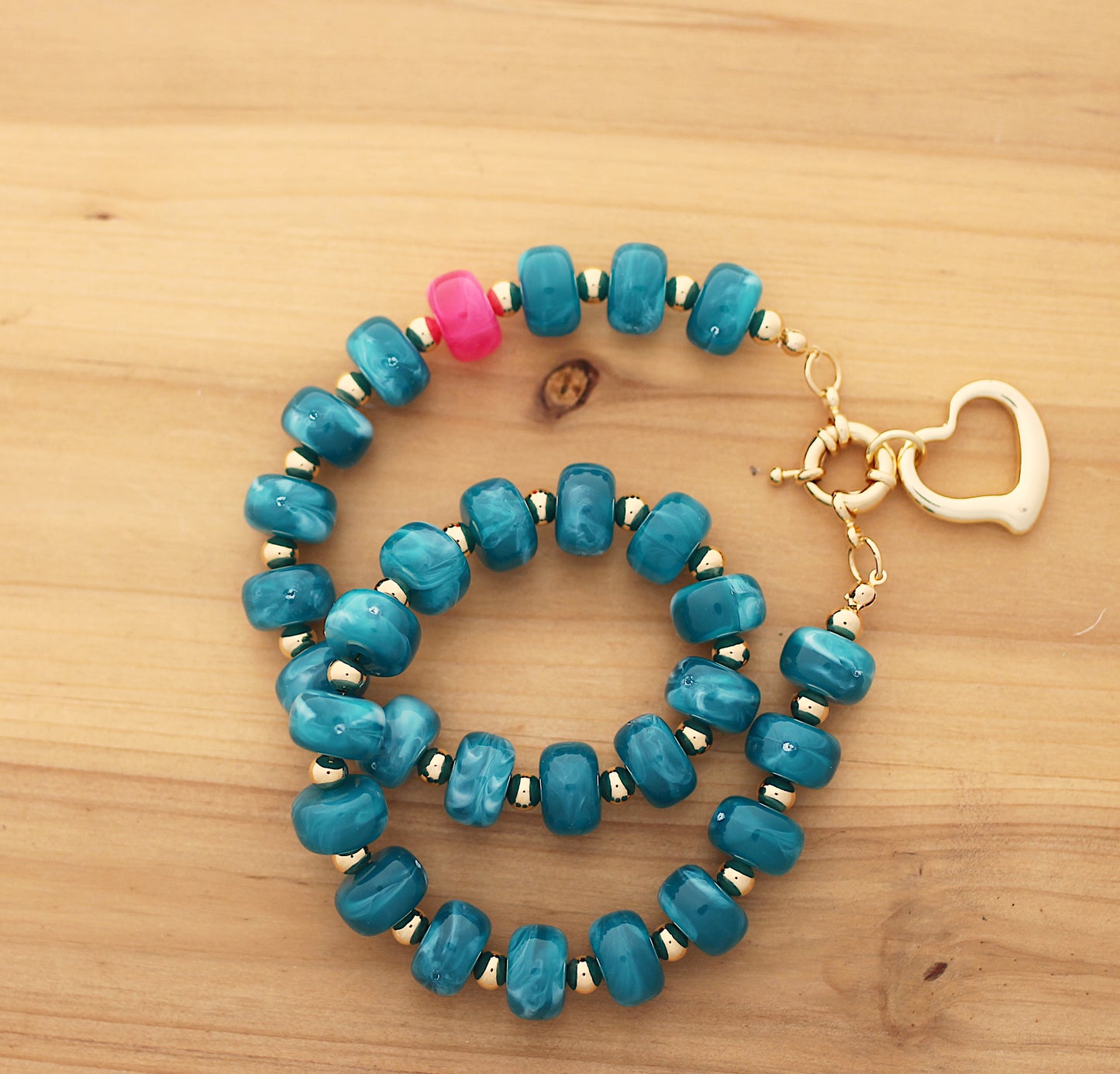 Donut shape green emerald necklace with heart charm