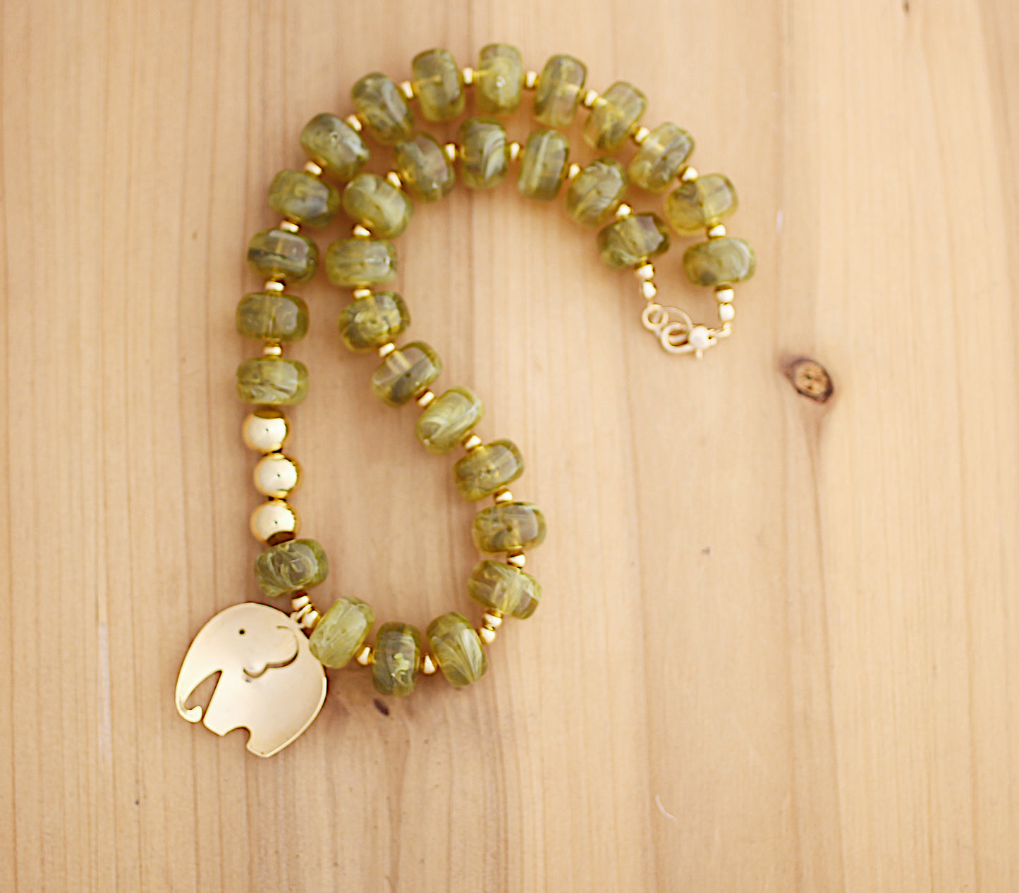 Donut shape olive beads with an elephant charm necklace