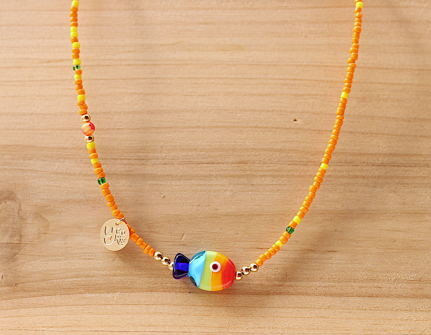 Orange seeds necklace with multicolor fish
