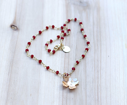 Red glass bead with clover