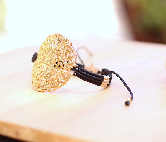 Macramé black and tan with a round apliqué divider