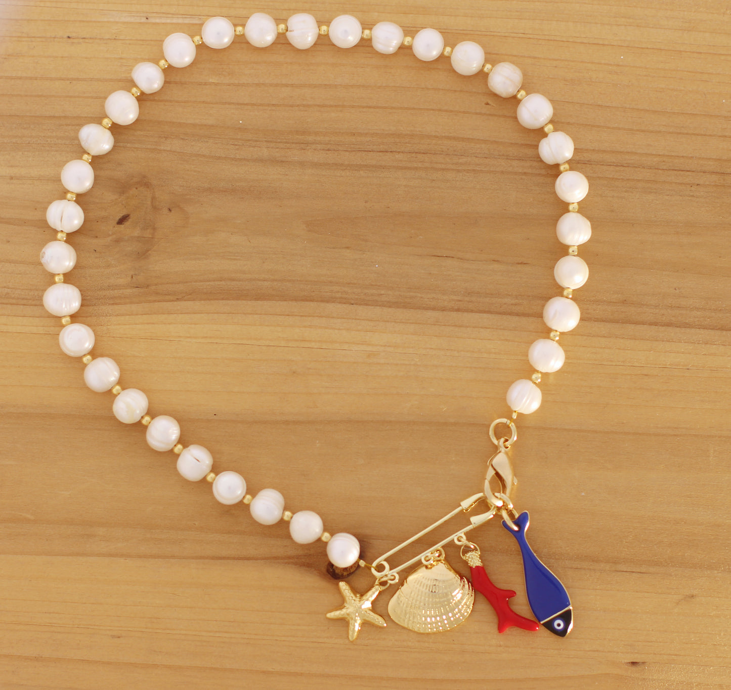 Pear necklace with sea motifs charms