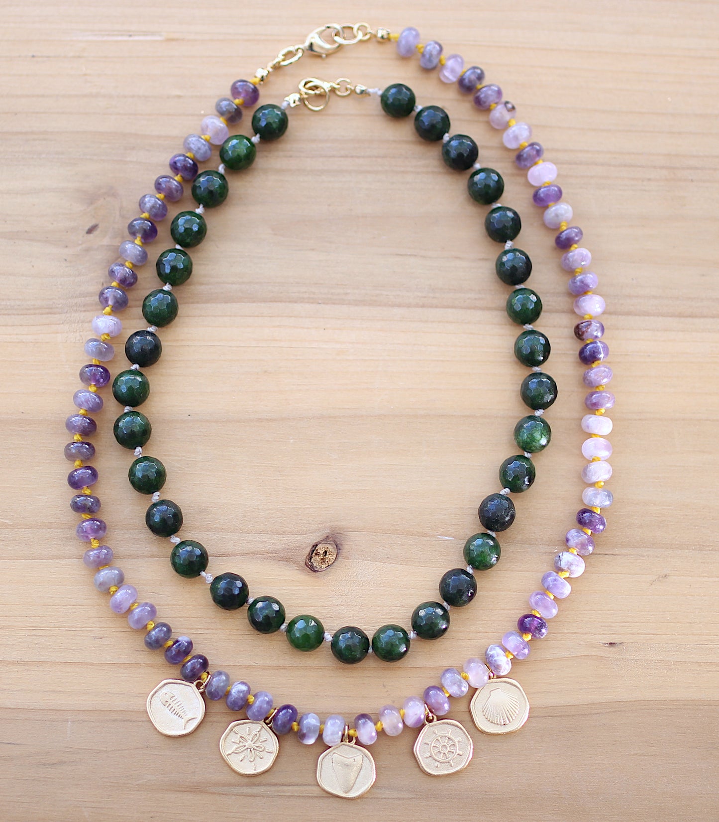 Purple necklace with sea motif round metals