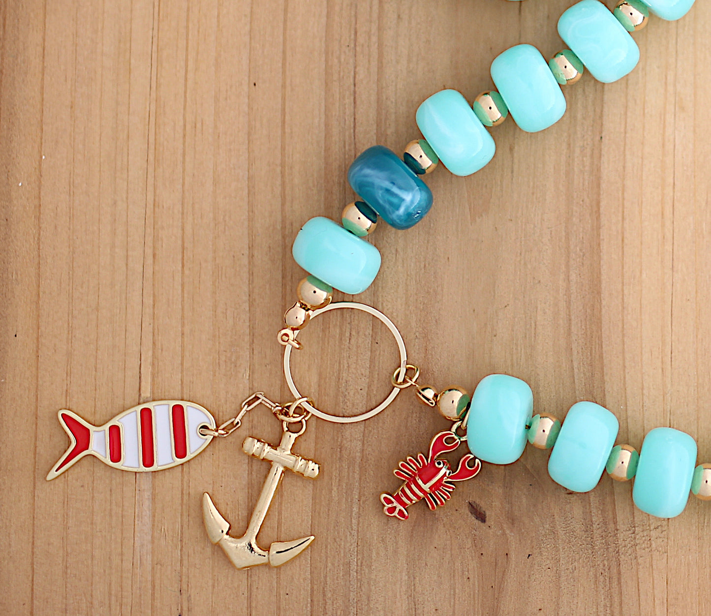 Light green necklace with sea motif charm