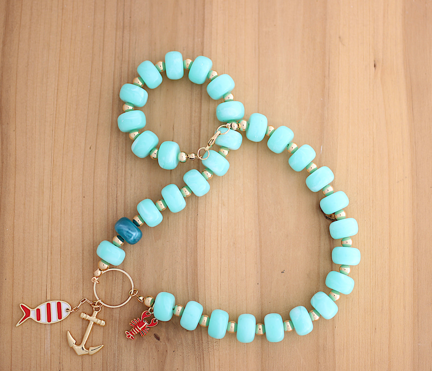 Light green necklace with sea motif charm