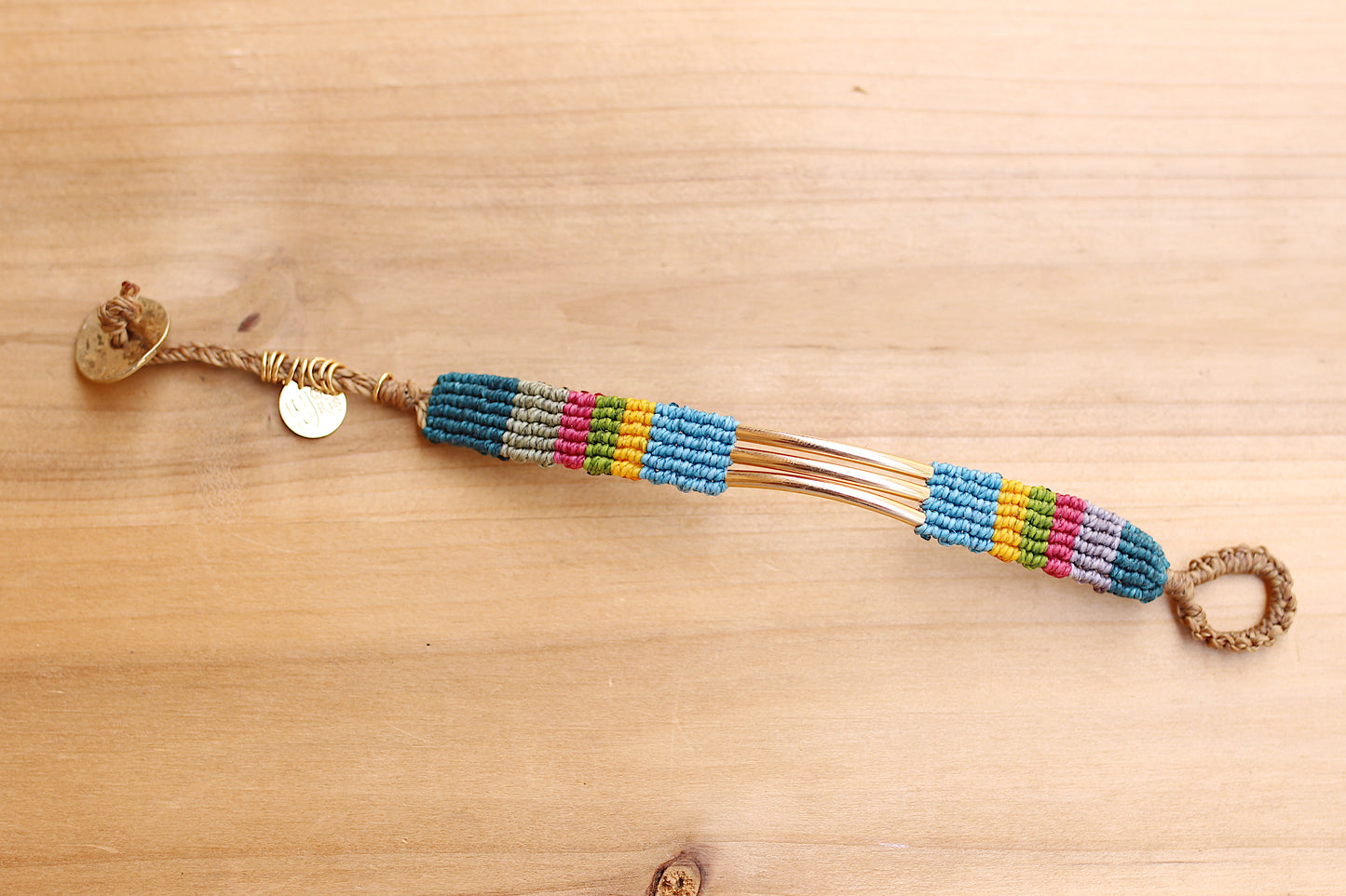 Multi color bracelet with braided tail