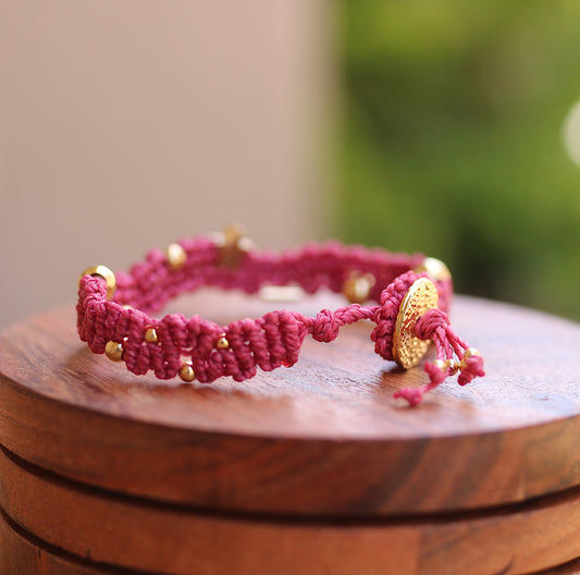 Red wavy bracelet with gold details