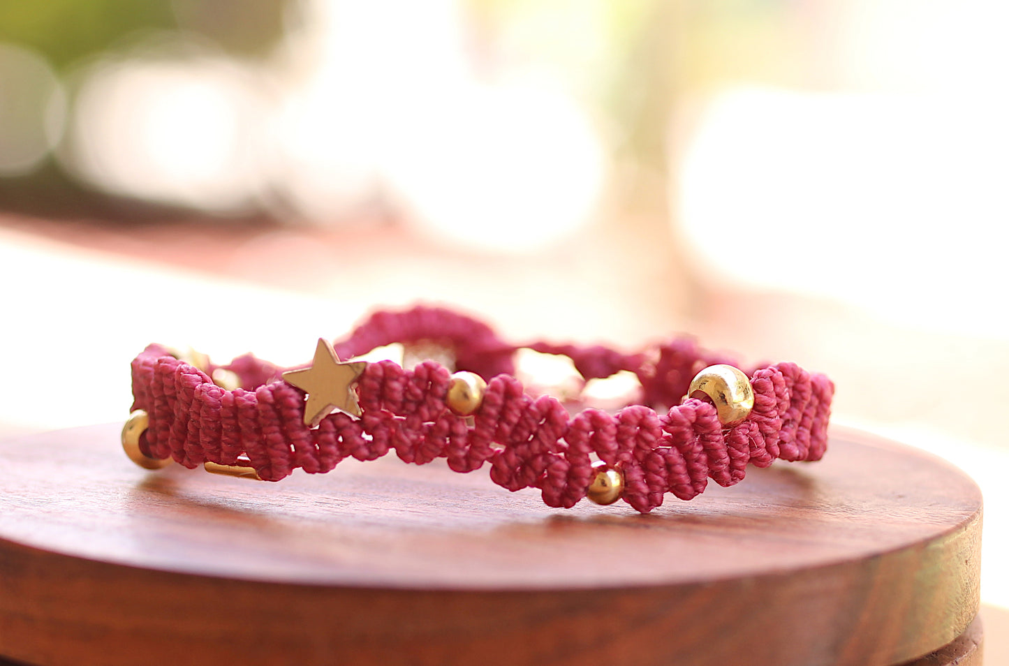 Red wavy bracelet with gold details