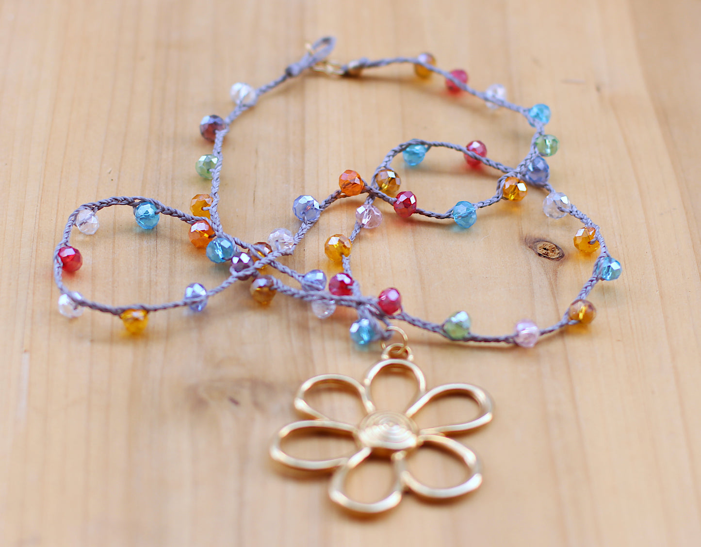 Multicolor beads necklace with a gold filled oversized flower