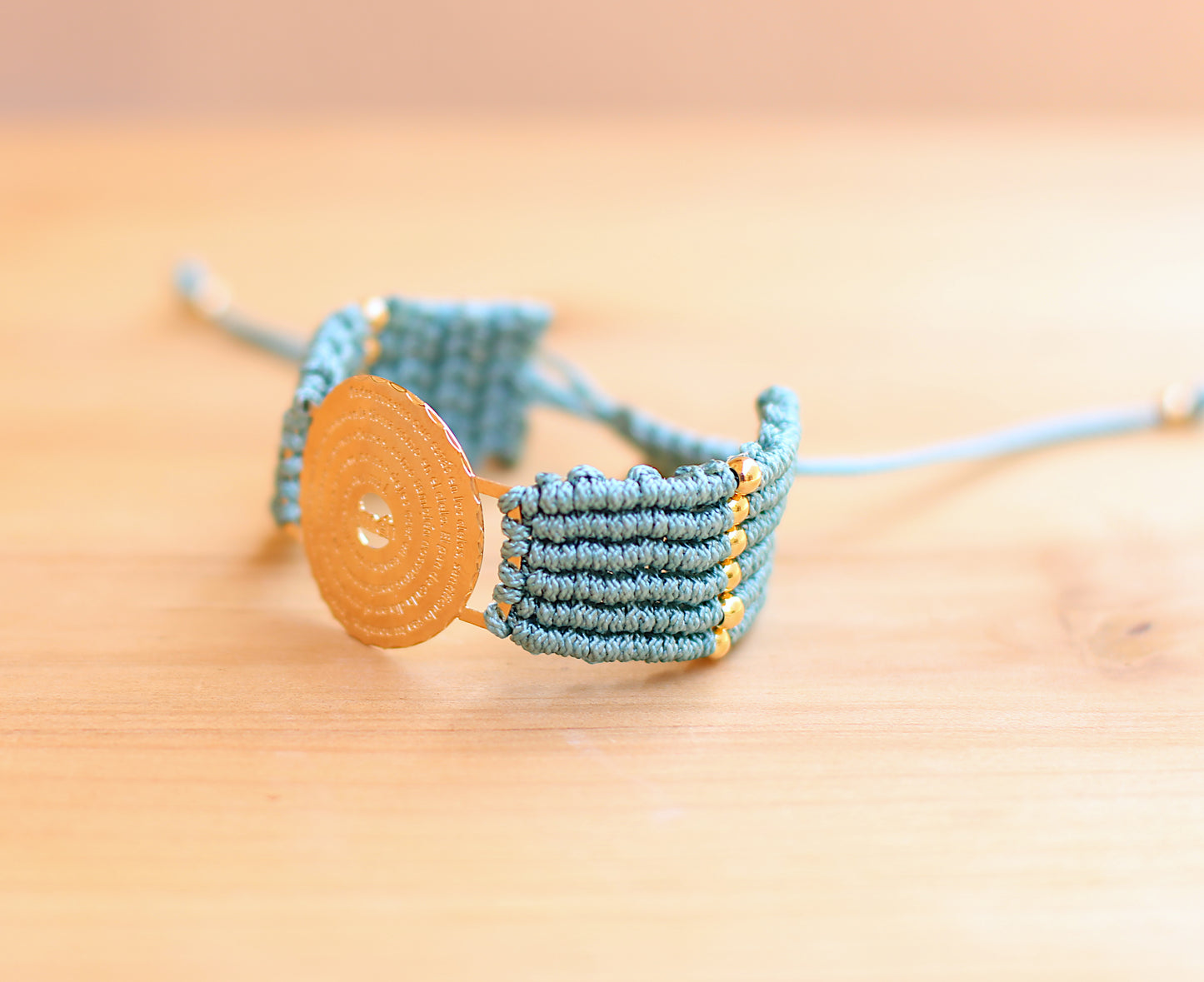 Padre Nuestro Divider with blue bracelet