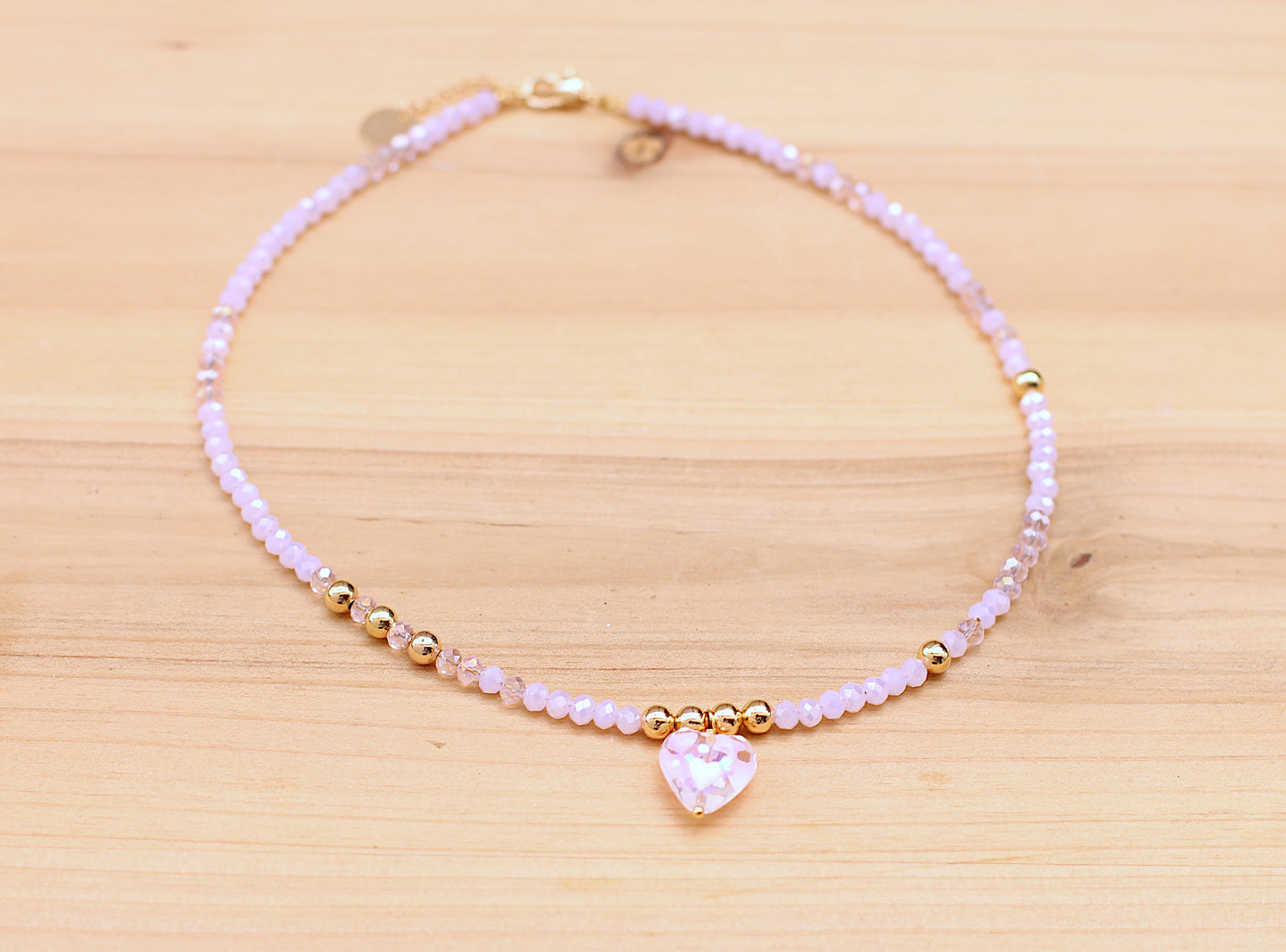 pink necklace with a heart charm