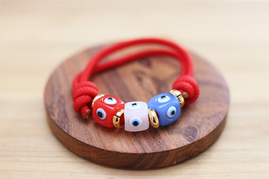 Red sliding knots bracelet with evils eye